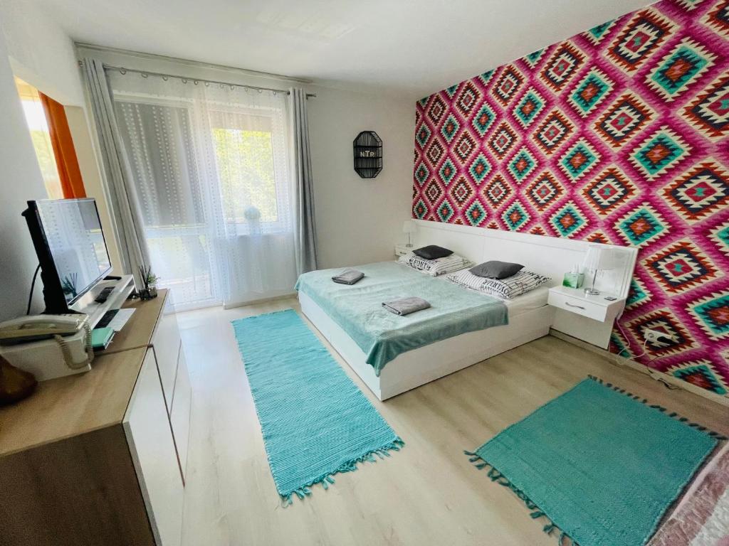 Posteľ alebo postele v izbe v ubytovaní Joy Apartman
