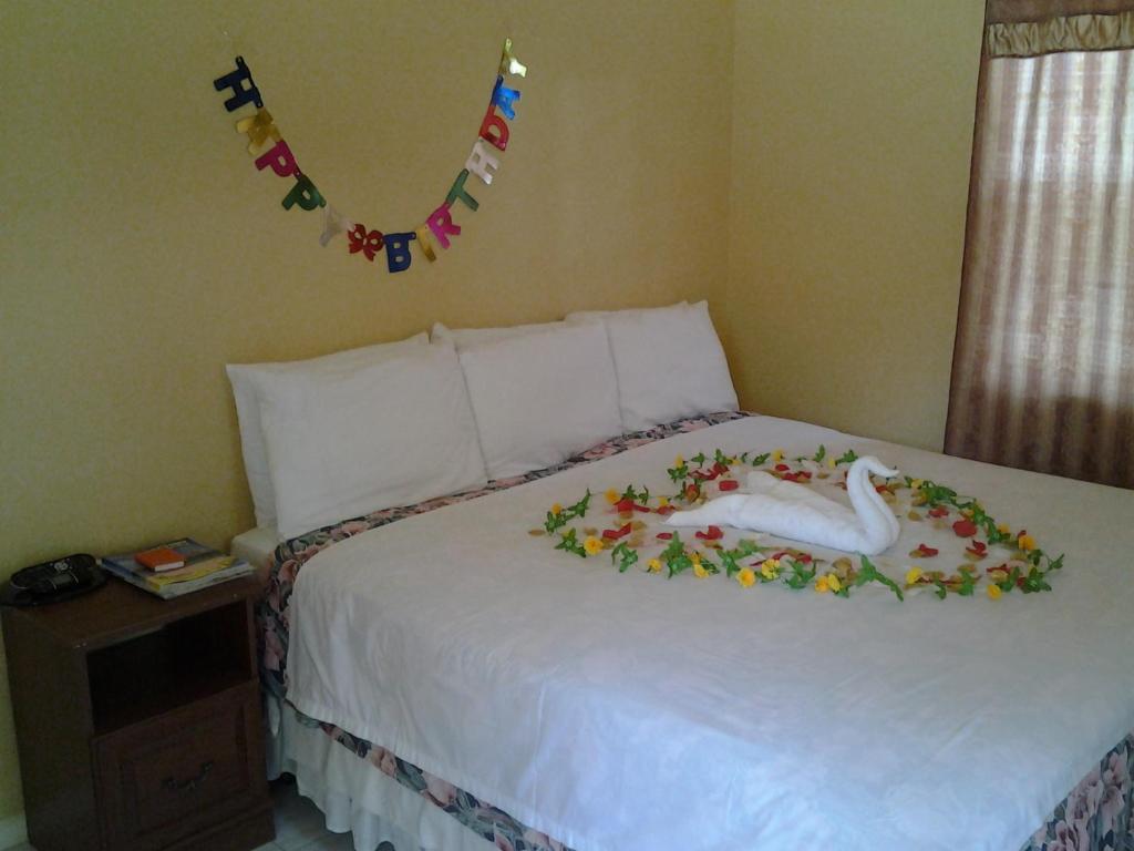 Postel nebo postele na pokoji v ubytování Aupic Paradise
