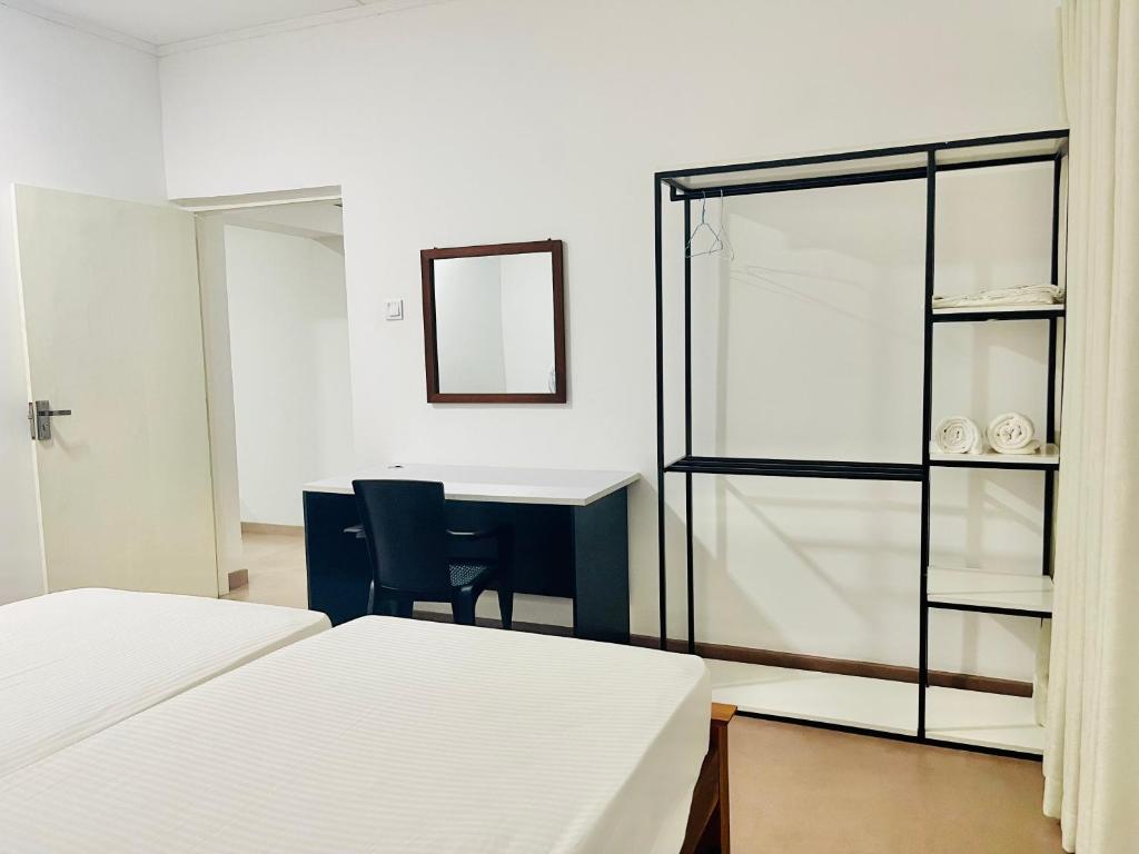 Postel nebo postele na pokoji v ubytování The Colombo Home