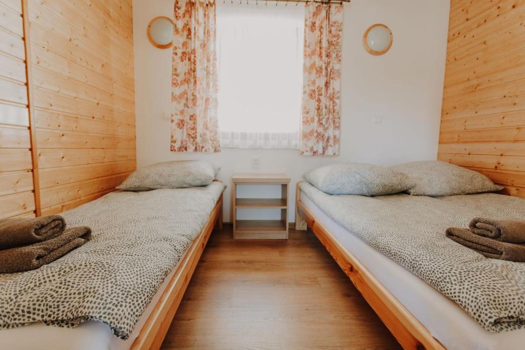 Postel nebo postele na pokoji v ubytování Domki Ania