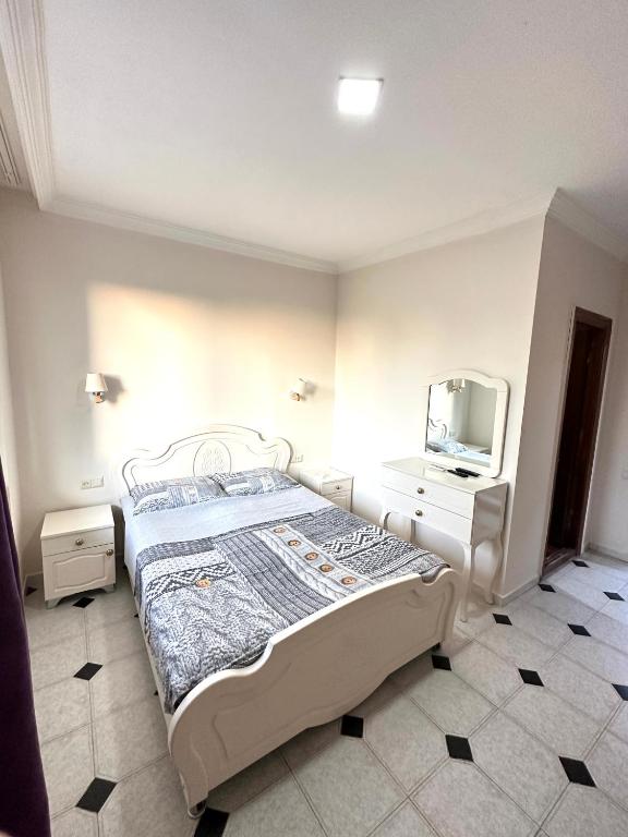 Postel nebo postele na pokoji v ubytování Hotel Tbiliselebi