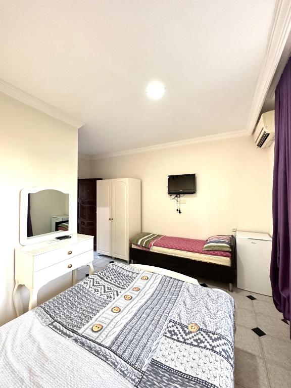 Postel nebo postele na pokoji v ubytování Hotel Tbiliselebi