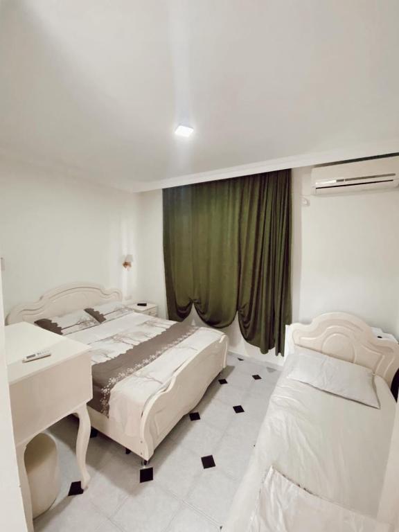 Postel nebo postele na pokoji v ubytování Hotel Tbiliselebi