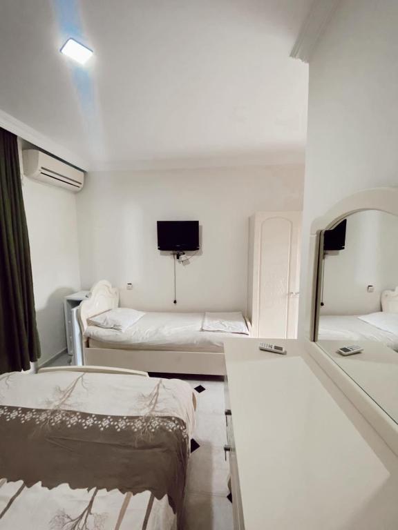 Postel nebo postele na pokoji v ubytování Hotel Tbiliselebi
