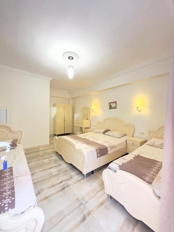 Postel nebo postele na pokoji v ubytování Hotel Tbiliselebi