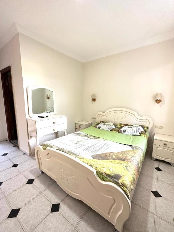 Postel nebo postele na pokoji v ubytování Hotel Tbiliselebi
