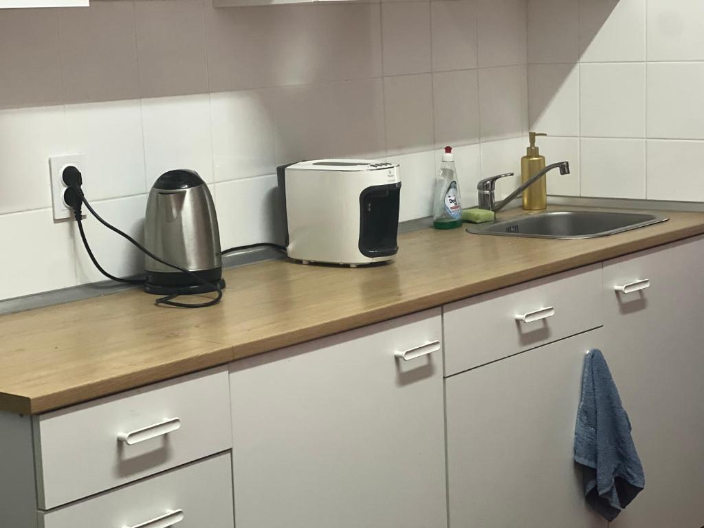 Kuchyň nebo kuchyňský kout v ubytování Apartment Moon