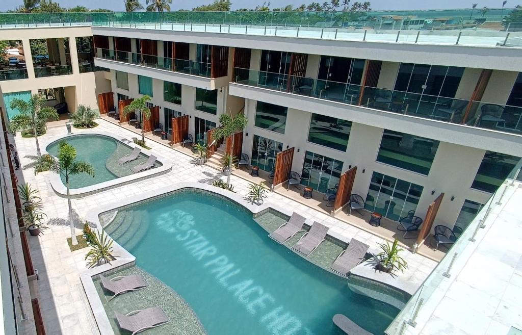 an overhead view of a building with a swimming pool at Star Palace Hotel Jeri in Jericoacoara