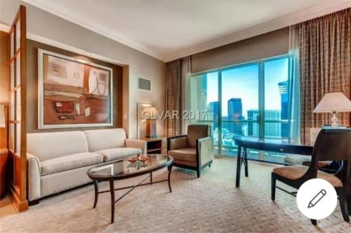 a living room with a couch and a table at MGM Signature PH 30th floor Deluxe Studio apartment Strip Facing with Balcony in Las Vegas