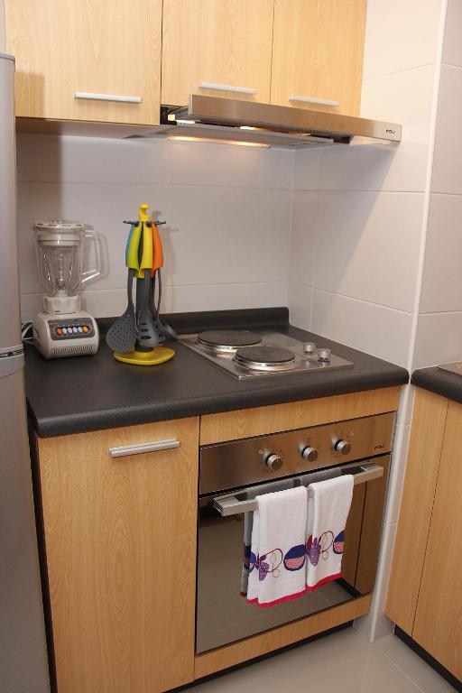 Kuchyň nebo kuchyňský kout v ubytování Concepción Suites