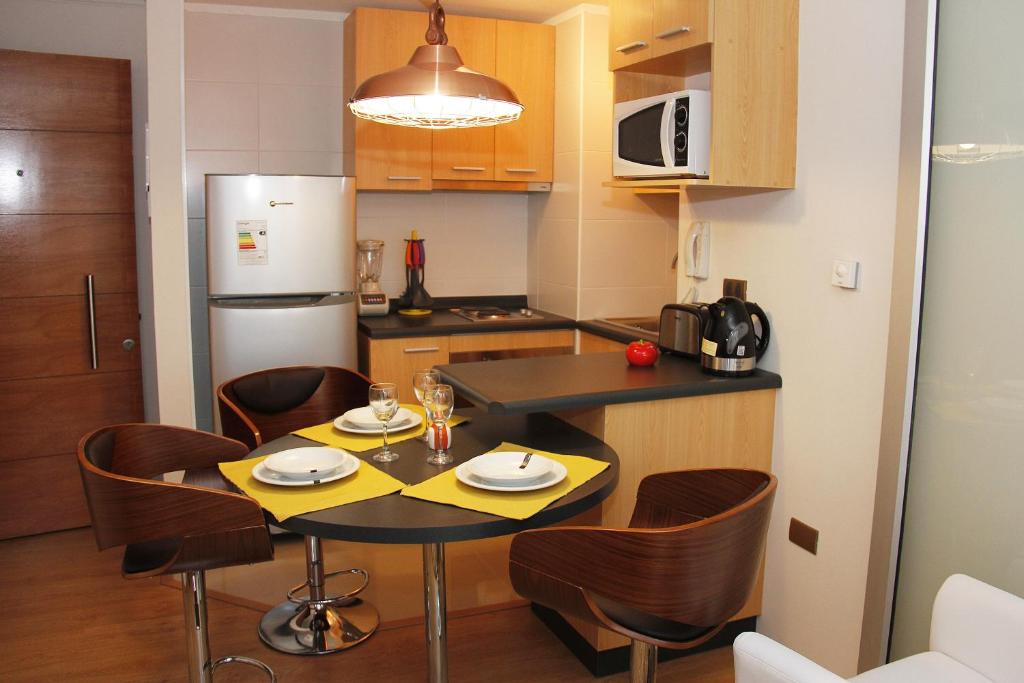 Kuchyň nebo kuchyňský kout v ubytování Concepción Suites