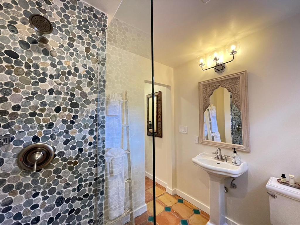 a bathroom with a shower and a sink at Casa Culinaria - The Gourmet Inn in Santa Fe