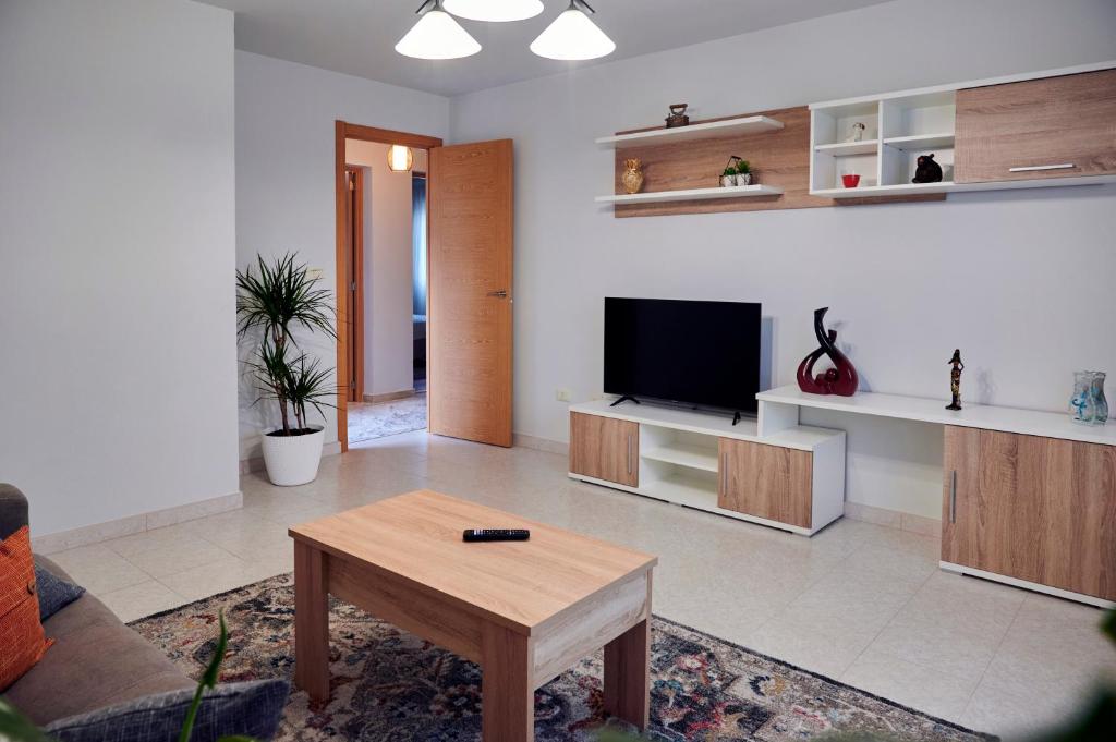 Televízia a/alebo spoločenská miestnosť v ubytovaní Casa Costal