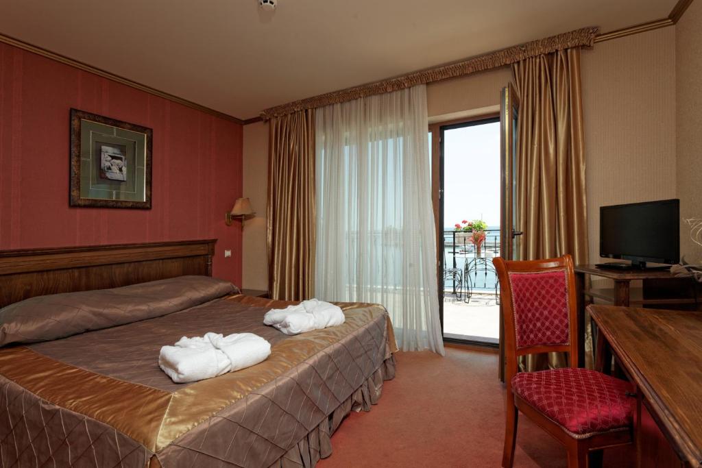 Postel nebo postele na pokoji v ubytování Hotel Mistral