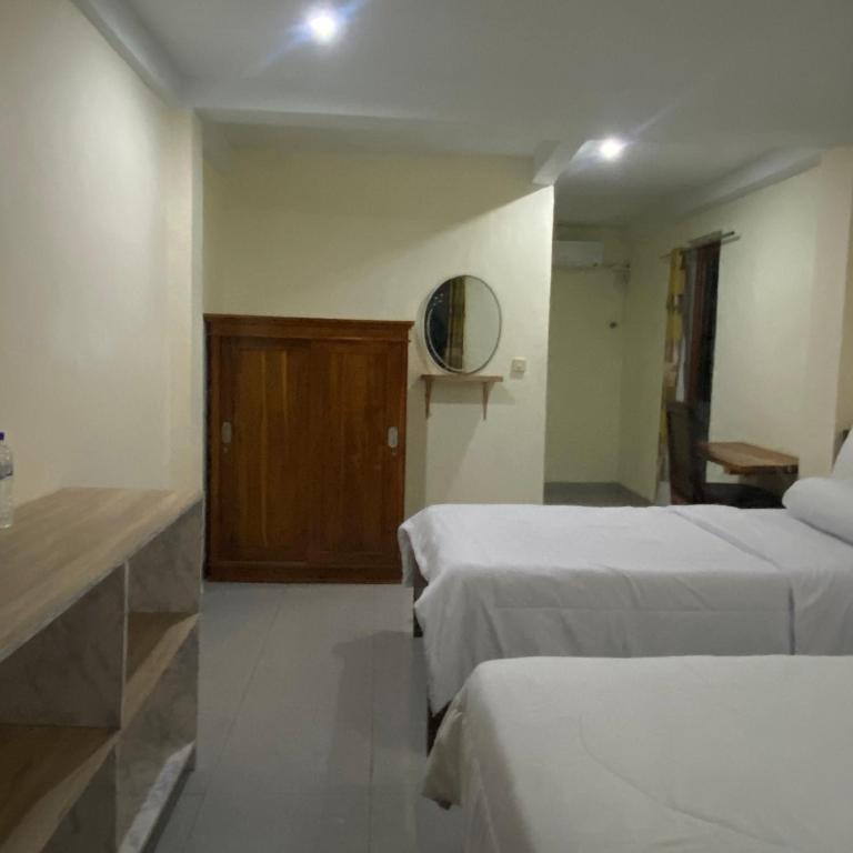 Postel nebo postele na pokoji v ubytování Pesona bali Room and restaurant