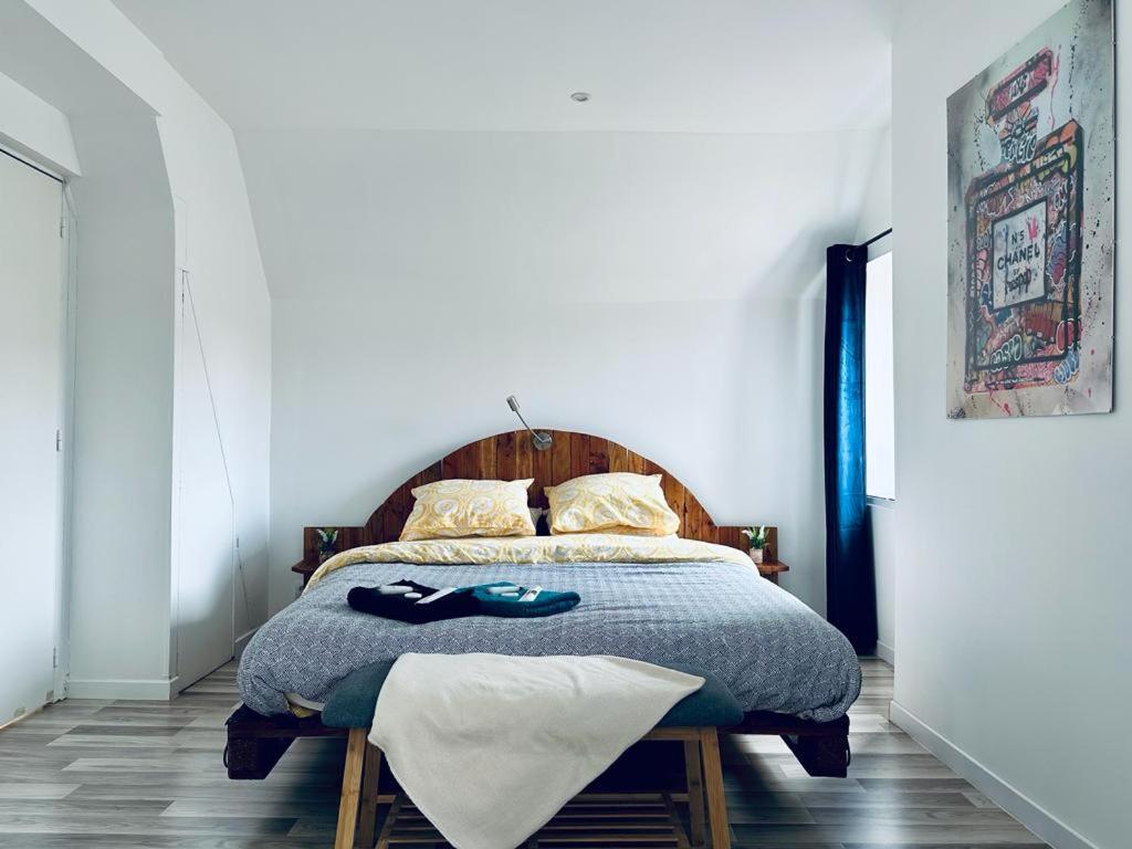 מיטה או מיטות בחדר ב-La Perle