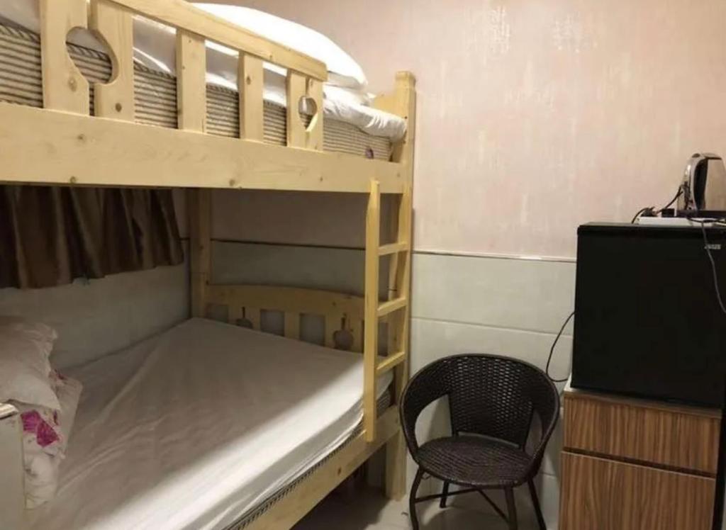 Postel nebo postele na pokoji v ubytování 泰豪賓館