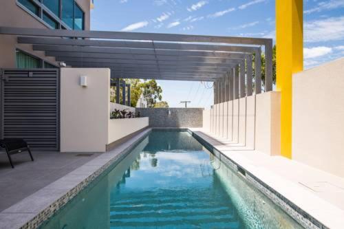 a swimming pool in the middle of a building at Nova Apartment Mooloolaba Beach in Mooloolaba