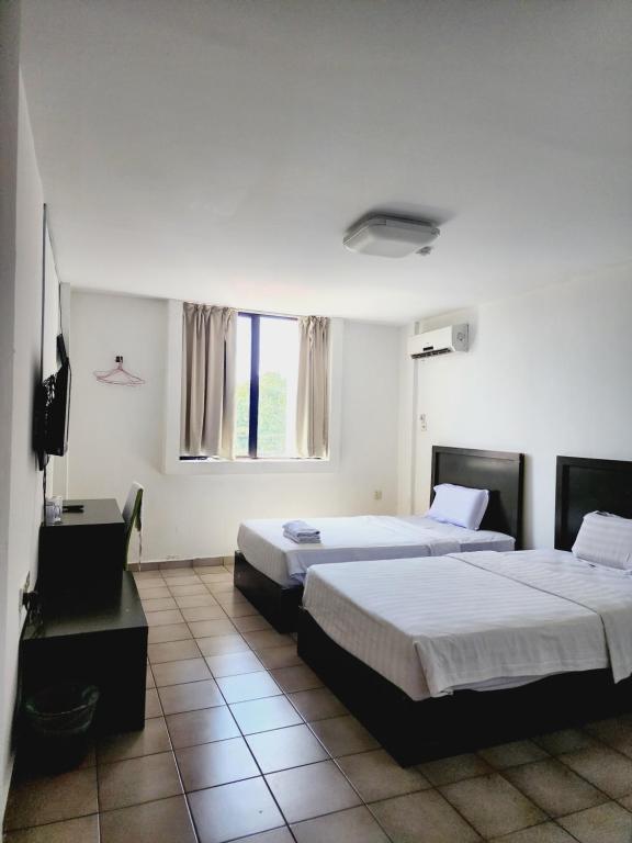 Postel nebo postele na pokoji v ubytování Y Hotel