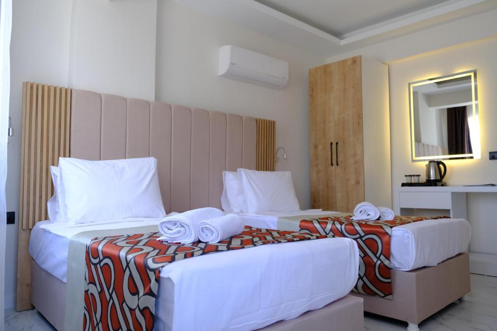 Postel nebo postele na pokoji v ubytování Optimum Luxury Hotel&Spa