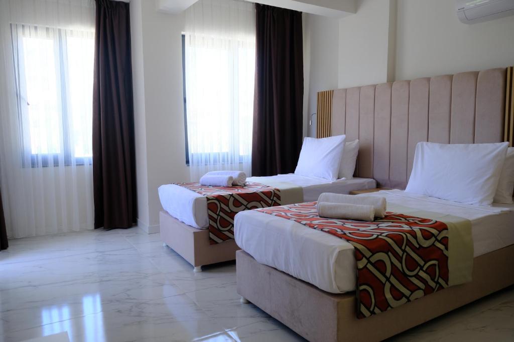 Postel nebo postele na pokoji v ubytování Optimum Luxury Hotel&Spa