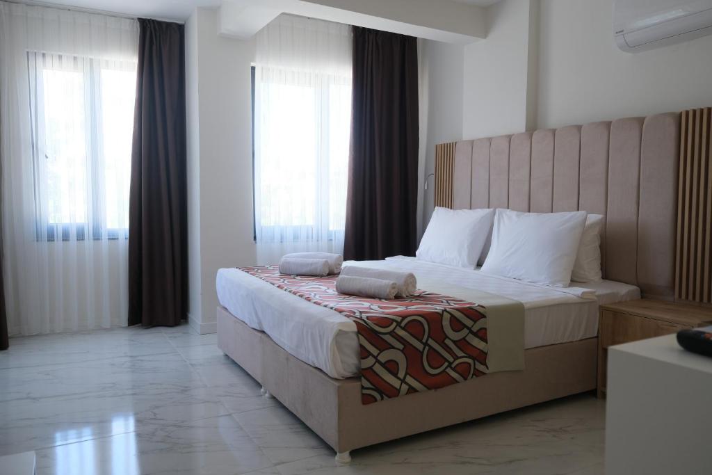 Postel nebo postele na pokoji v ubytování Optimum Luxury Hotel&Spa