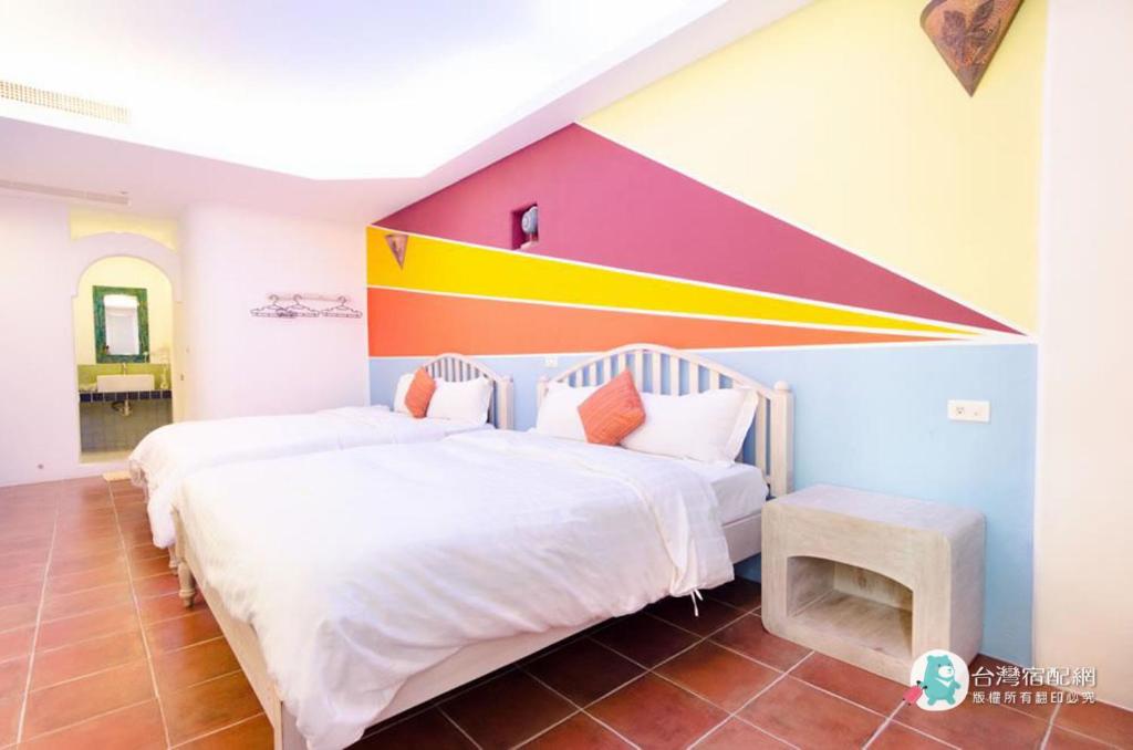 Postel nebo postele na pokoji v ubytování Long Yuan Ju Homestay