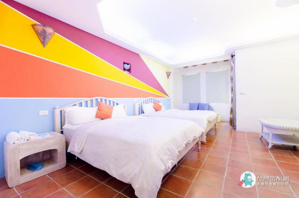 Postel nebo postele na pokoji v ubytování Long Yuan Ju Homestay