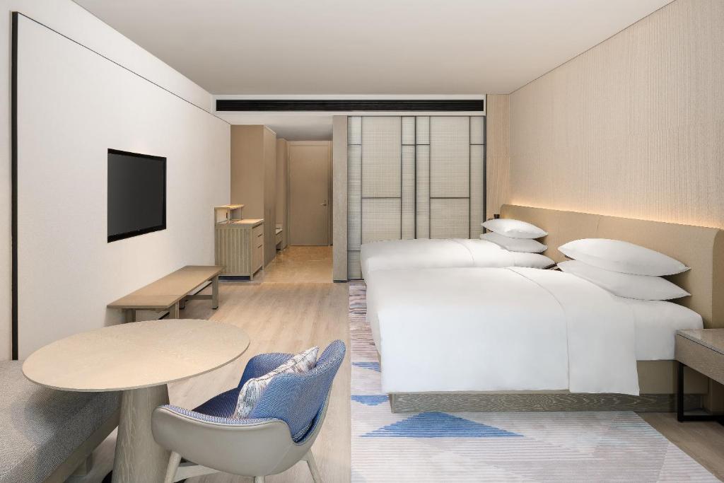 Postel nebo postele na pokoji v ubytování Sheraton Beihai Resort