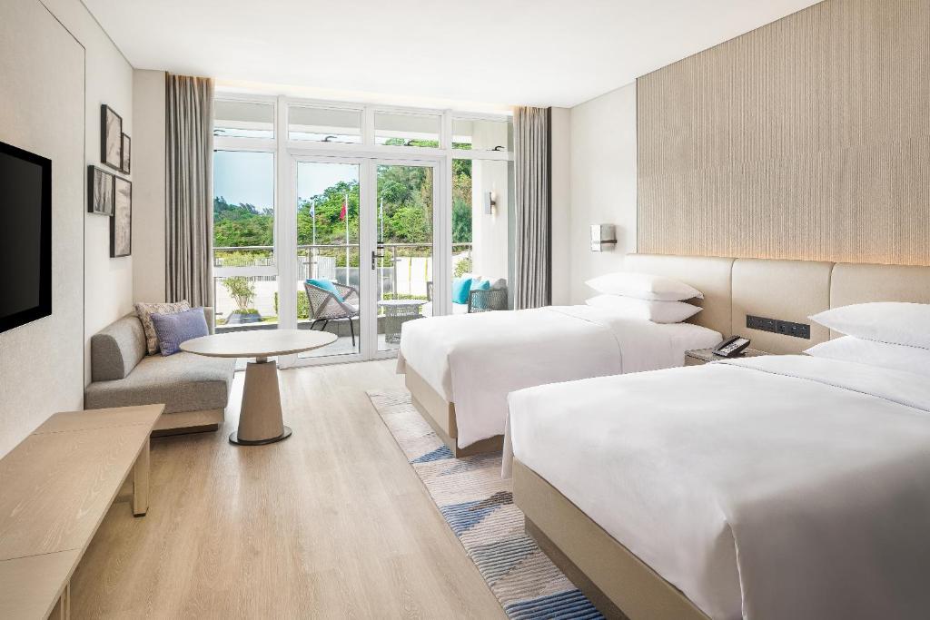 Postel nebo postele na pokoji v ubytování Sheraton Beihai Resort