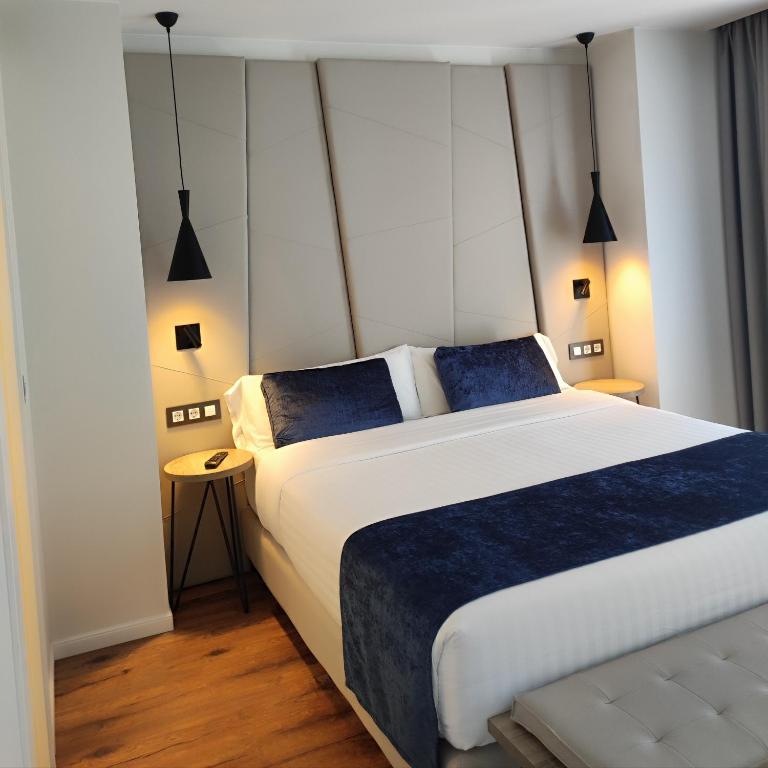 Posteľ alebo postele v izbe v ubytovaní Taverna de la Sal Boutique Hotel