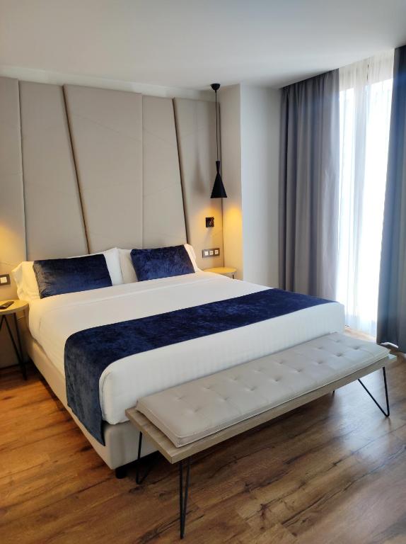 Posteľ alebo postele v izbe v ubytovaní Taverna de la Sal Boutique Hotel