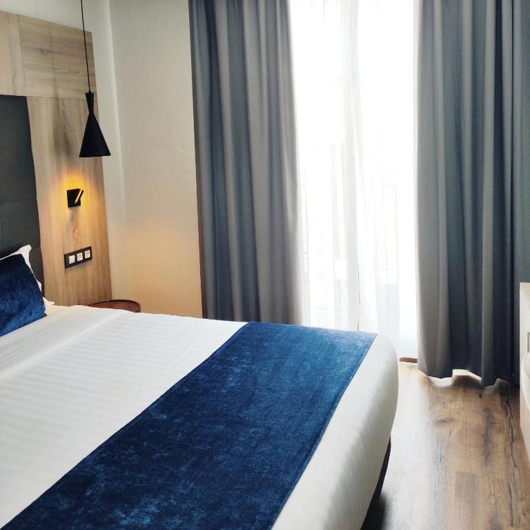 Posteľ alebo postele v izbe v ubytovaní Taverna de la Sal Boutique Hotel