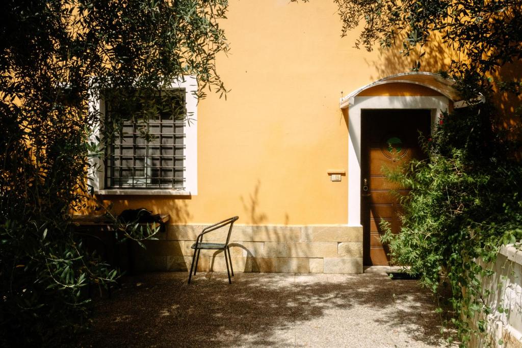 a chair sitting in front of a door at Casa Lunaria in Moscufo