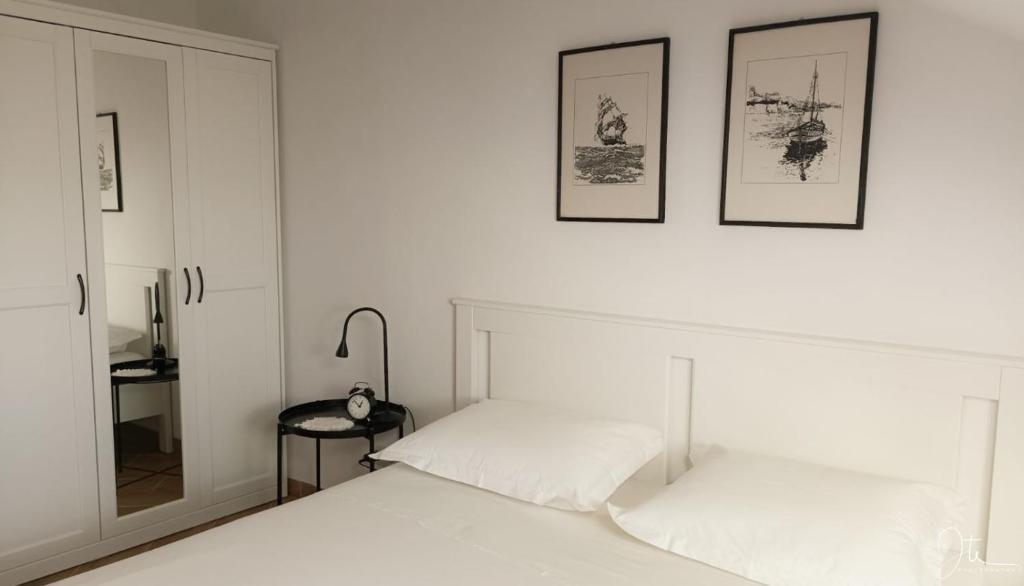 Postel nebo postele na pokoji v ubytování Apartmani Matiša