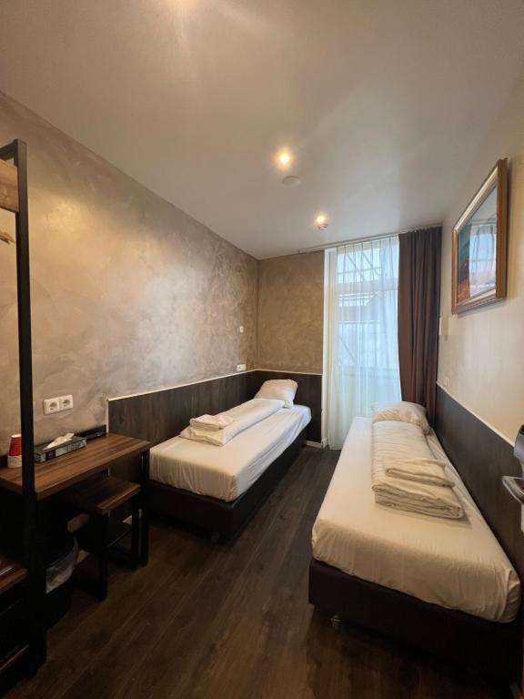 Ένα ή περισσότερα κρεβάτια σε δωμάτιο στο Orange Tulip Hotel