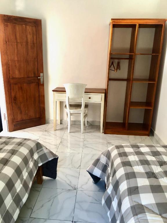 Postel nebo postele na pokoji v ubytování LOPE HOMESTAY