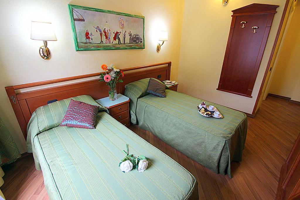 Postel nebo postele na pokoji v ubytování Hotel Bright
