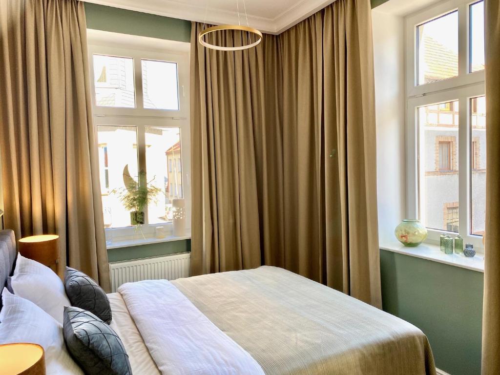 Ένα ή περισσότερα κρεβάτια σε δωμάτιο στο Apartament Morska 5-4