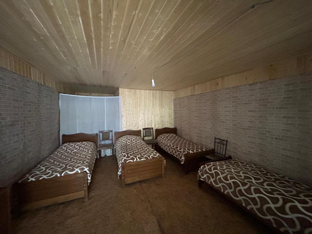 Letto o letti in una camera di Shio's Stonehouse in Tusheti