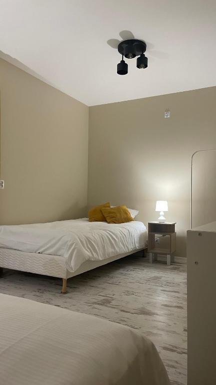 Postel nebo postele na pokoji v ubytování Oskarówka Kaszuby z balią