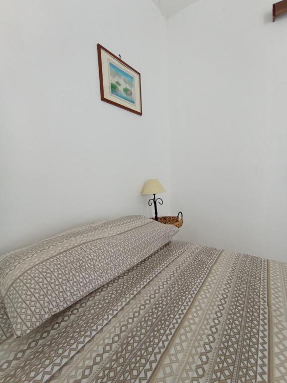 Postel nebo postele na pokoji v ubytování Stanze nel verde