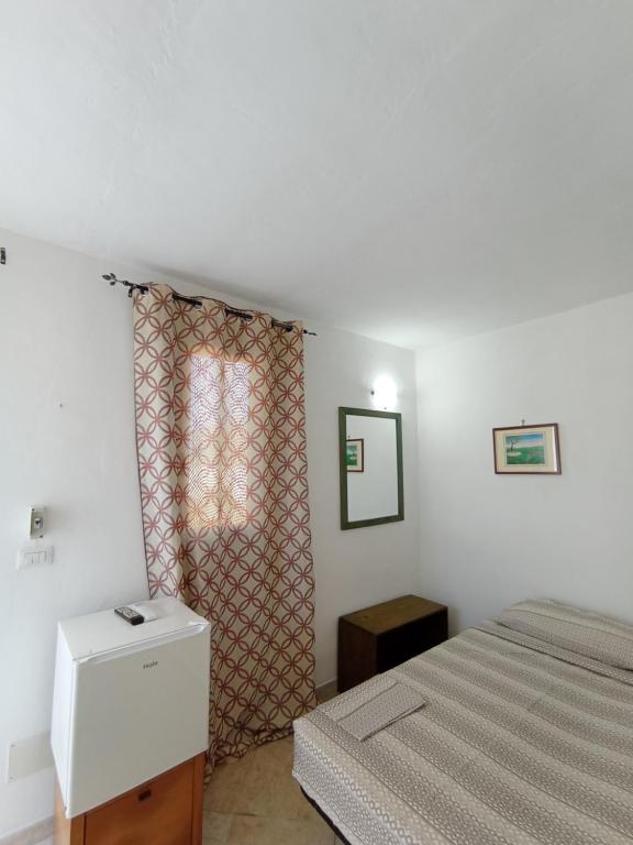 Postel nebo postele na pokoji v ubytování Stanze nel verde