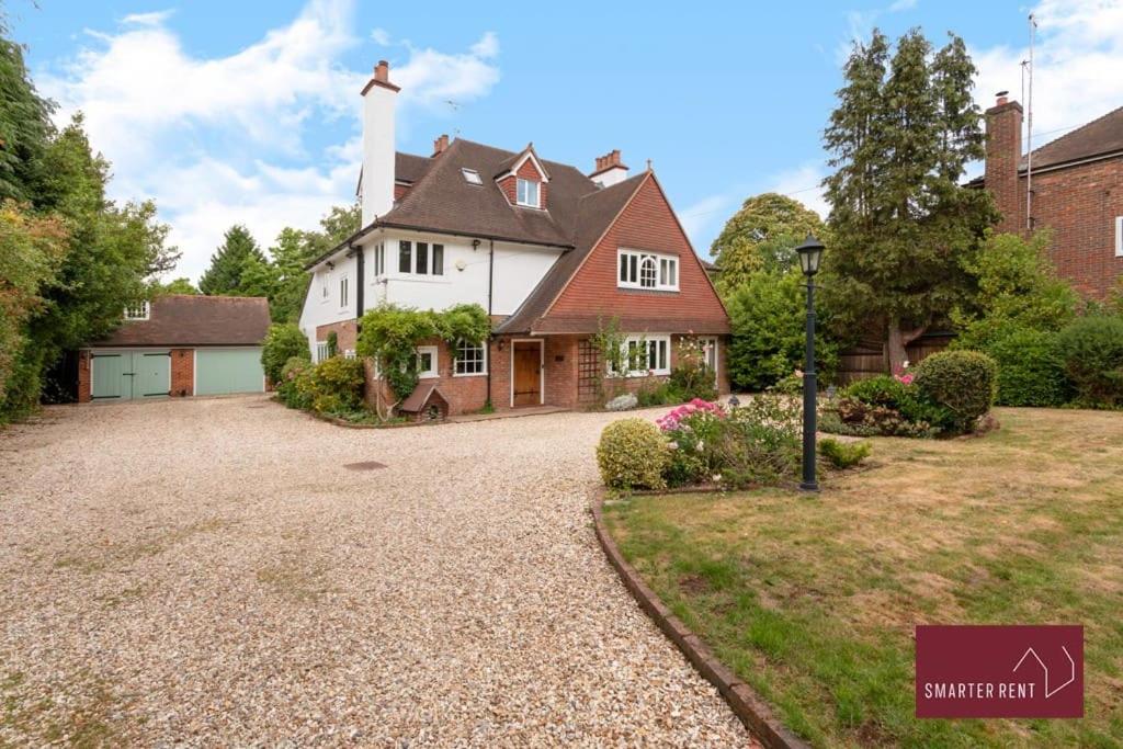 a large white house with a white lighthouse at Farnborough - Grand 4 Bed Home in Cove