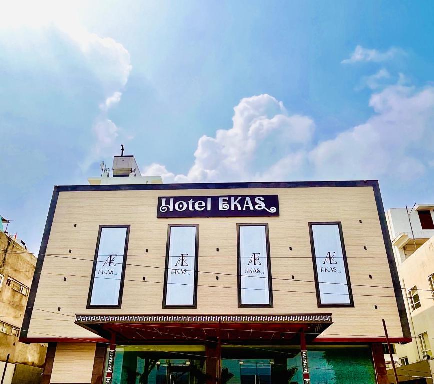 a building with a sign on the top of it at HOTEL EKAS in Charbagh