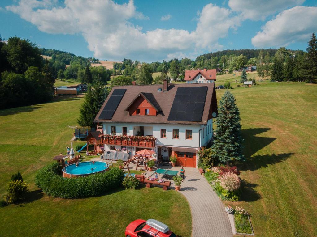 an aerial view of a large house with a swimming pool at U Sadílků in Paseky nad Jizerou