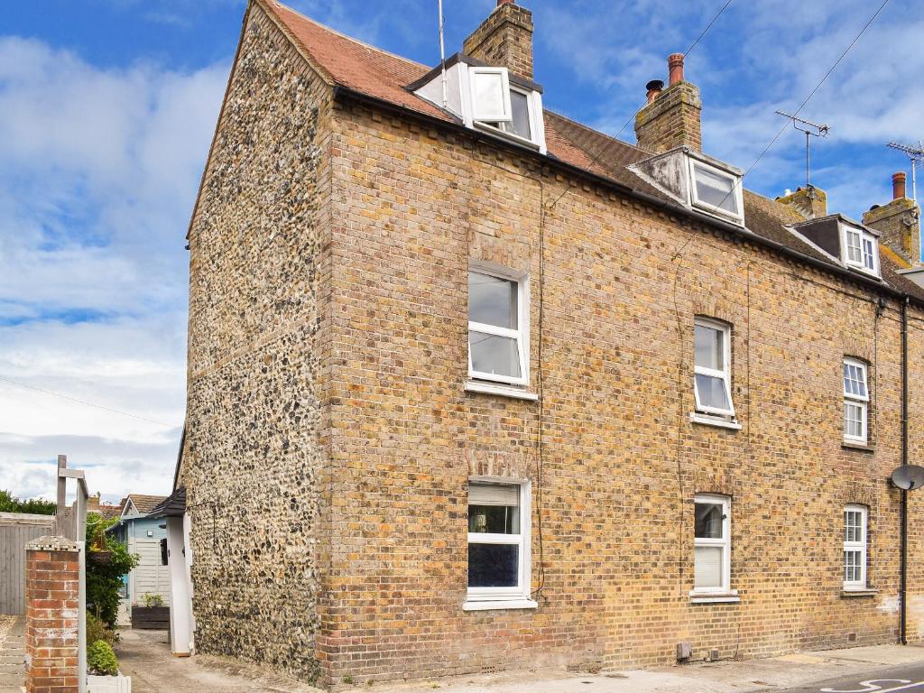 an old brick building with windows and chimneys at The Epple Bay Retreat in Birchington