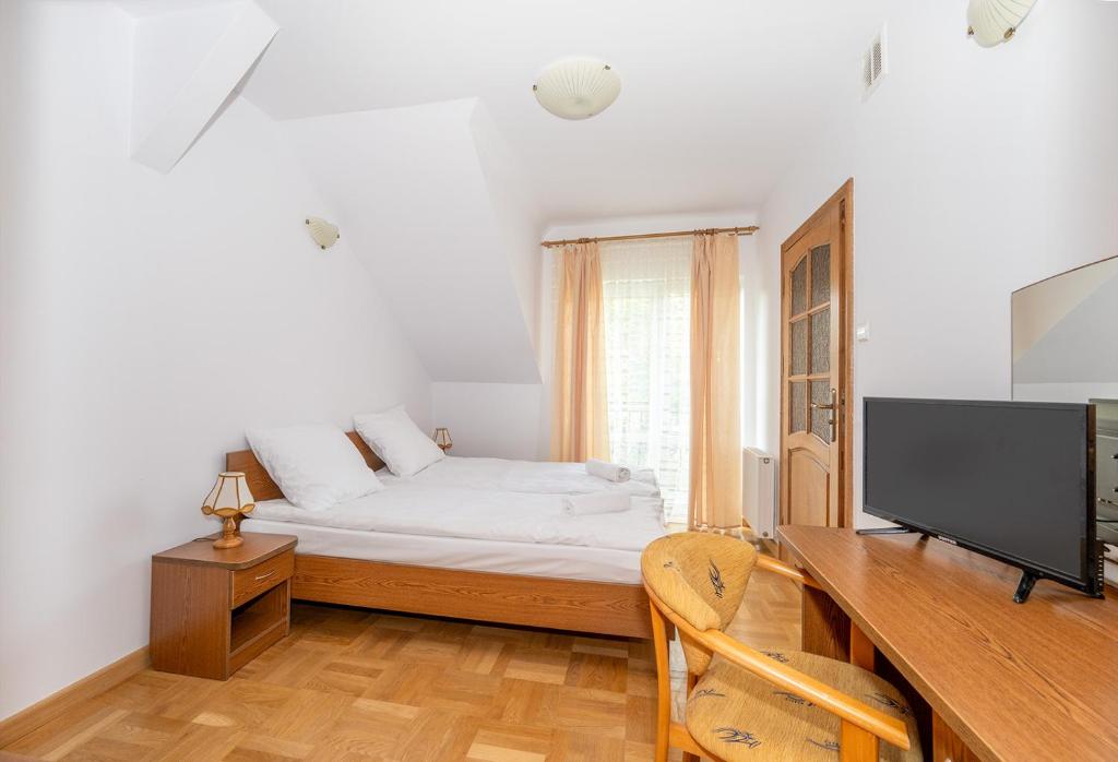 Postel nebo postele na pokoji v ubytování Gościniec Jędruś