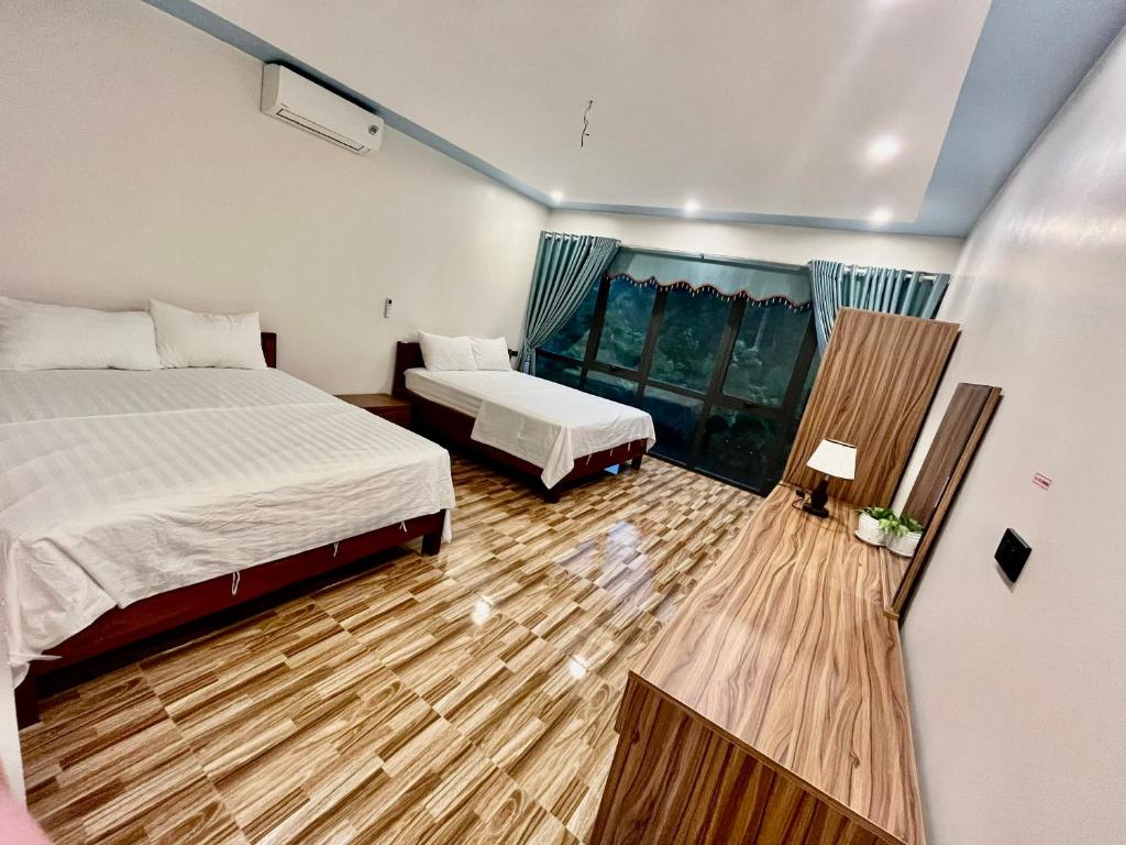 Postel nebo postele na pokoji v ubytování Phong Nha Moonlight Villas