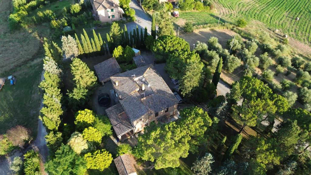 an aerial view of a large house with trees at Casa cecchi siena in Siena